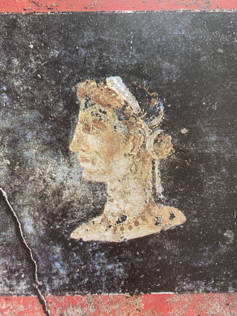 Pompeian wall painting showing a female bust